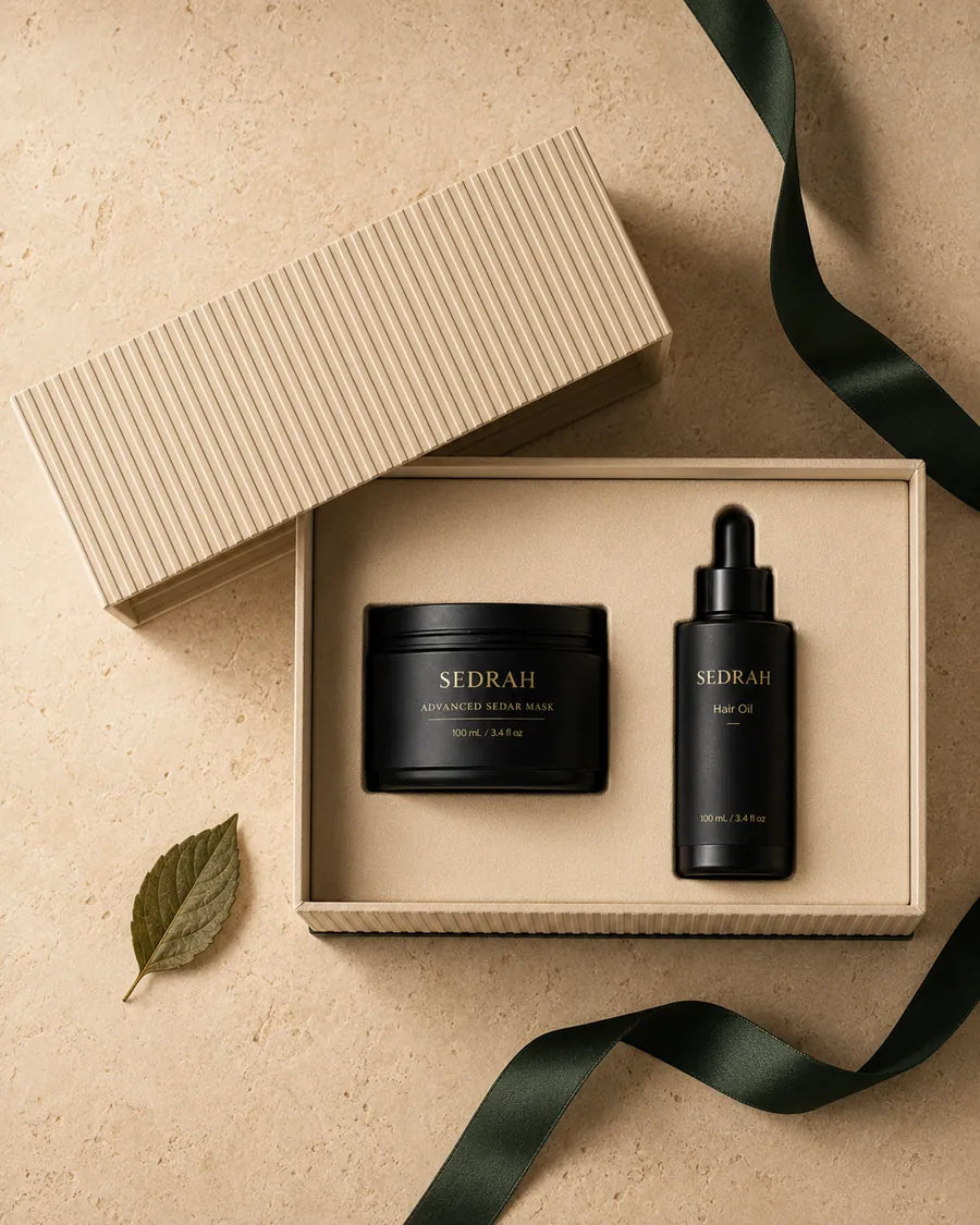 The Sedar Ritual flat lay — open gift box with green ribbon and Sidr leaf